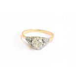 An early 20th century 18ct gold and platinum set diamond solitaire ring, the large old cut diamond