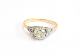 An early 20th century 18ct gold and platinum set diamond solitaire ring, the large old cut diamond