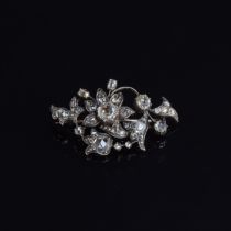 A 19th century diamond brooch, designed as a floral spray, with a variety of diamond cuts