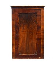 A Biedermeier walnut cabinet, c.1820, the cupboard door with wavy edge, 102cm wide, 49cm deep, 159cm