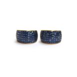A pair of heavy 18ct gold earrings set with calibre cut sapphires, each set with approx. 4.7cts of