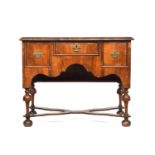 A William & Mary walnut lowboy, moulded top over three drawers, 104cm wide, 57cm deep, 83cm high