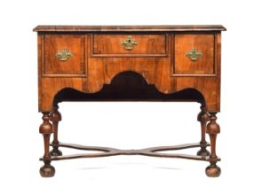 A William & Mary walnut lowboy, moulded top over three drawers, 104cm wide, 57cm deep, 83cm high