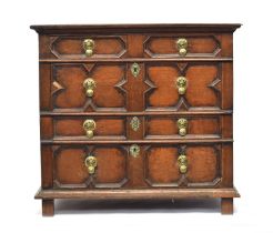 A Charles II joined oak chest of drawers, moulded top over two short and three long drawers with
