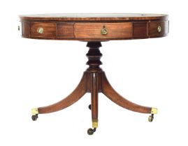A Regency mahogany drum top library table, the circular top with green leather skiver, four