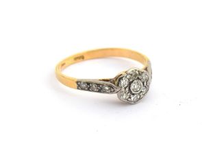 An early 20th century gold and diamond floral cluster ring, marks rubbed but tests as 14ct or