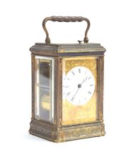 A 19th century French brass repeater carriage clock, the white enamel dial with Roman numerals,