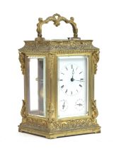 A late 19th century gilt metal carriage clock, stamped 'Aiguilles Reveil, 717..x, Moser A. Paris',