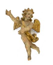 An 18th century carved painted and parcel gilt cherub, 88cm high overall