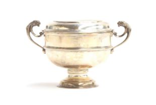 A George V silver twin handled cup and cover by S W Smith & Co, London 1924, twin lion handles,
