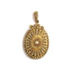 A Victorian yellow metal locket, profusely set with seed pearls in rayed petal shaped settings,