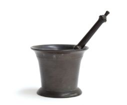 A 19th century bronze pestle and mortar, of bell form, 9cm high, the pestle 19cm long