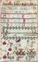 A 19th century needlework alphabet sampler worked by Charles Merriot, charmingly stitched with