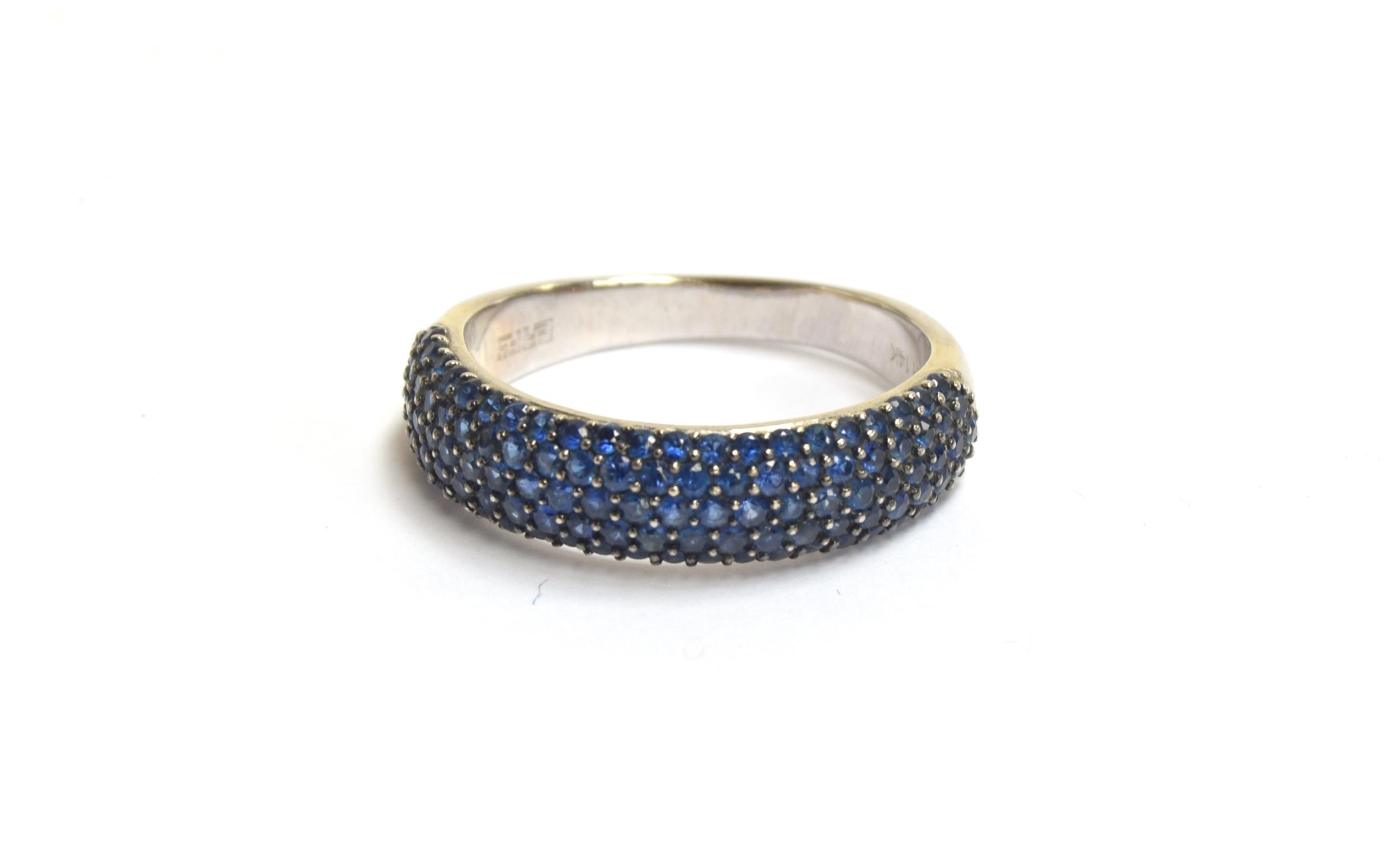 An Effy 14ct white gold half eternity ring pave set with sapphires, total carat weight approx. 1.