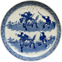 A Chinese blue and white porcelain dish depicting huntsmen on horseback, character marks to base, 16