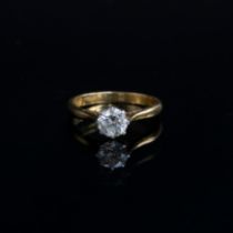 An 18ct gold and platinum set diamond solitaire ring, the diamond approx. 0.7cts, size L, 2.9g