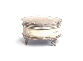 A George V circular silver trinket pot, Birmingham 1921, hinged cover with engraved ribbon