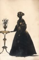 A mid 19th century silhouette portrait, lady with ringlets standing by a vase of flowers on a