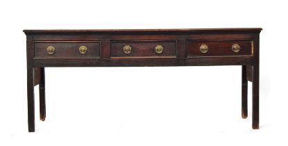 An 18th century mahogany dresser base, the moulded top over three heavily cockbeaded drawers, on