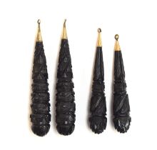 Two pairs of Victorian carved jet torpedo earring drops, with gold caps, 7.6cm long and 6.8cm long