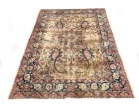 A large antique Persian Isfahan rug, large scrolling vines surround a central medallion, 296x403cm