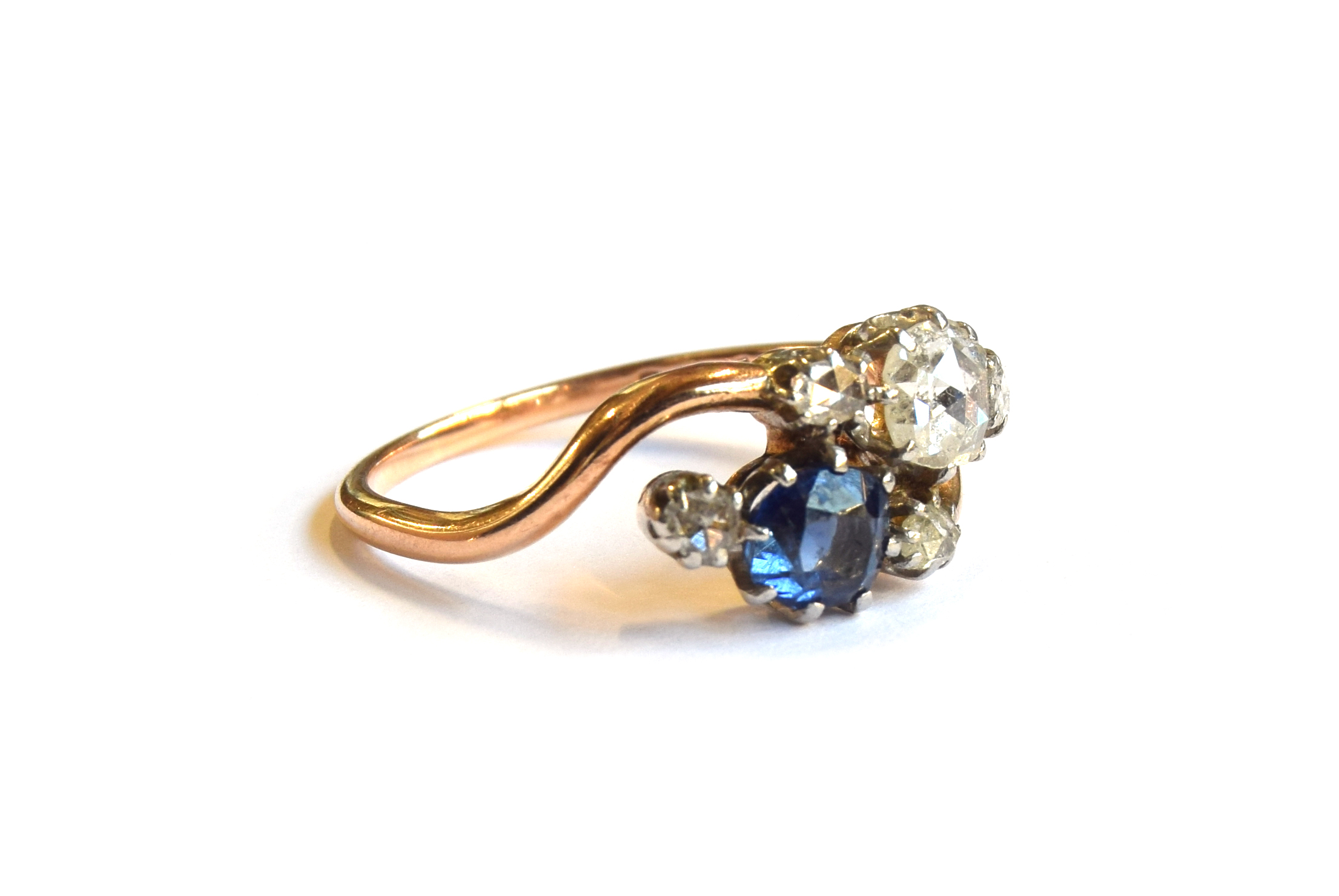 An early 20th century 18ct gold 'Toi et Moi' diamond and sapphire crossover ring, the large rose cut - Image 2 of 6