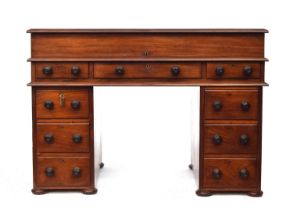 A Victorian pedestal desk, associated four tier whatnot above a hinged lid opening to a skiver and