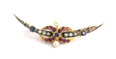 A Belle Epoque crescent brooch set with diamonds, rubies, sapphires and pearls, central interlocking