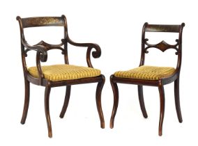 A set of eight Regency simulated rosewood and brass inlay dining chairs, two carvers, scroll back