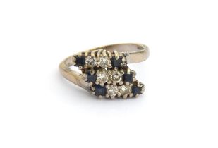 An 18ct white gold ring set with three rows of sapphires and diamonds, size O 1/2, 6g