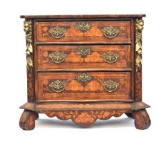An 18th century and later Dutch serpentine marquetry chest of three drawers, allover floral inlay,