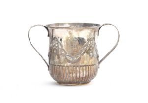 A George III twin handled mug by James Stamp, London 1779, half fluted body, chased with bell flower
