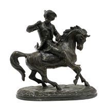 A spelter figure of a rider on horseback, 22cmH
