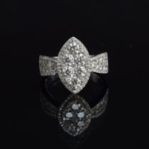 A substantial 18ct white gold diamond ring of navette form, the six central large diamonds set