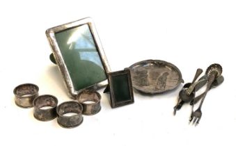 A very small silver photo frame; together with a plated photo frame, etc