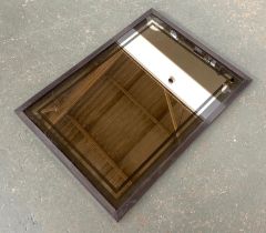 A smoked glass rectangular mirror, 85x62cm