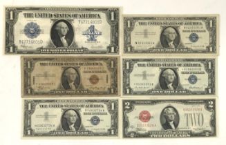 Five United States one dollar silver certificates comprising series of 1923, 1935 A with Hawaii