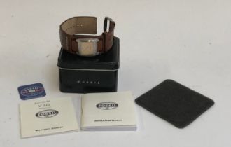 A gents Fossil watch, in box with papers