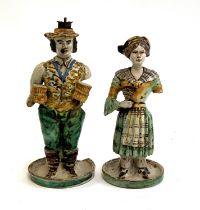 A pair of Vietri pottery style majolica figural candle holders (af), 34cmH and 30cmH