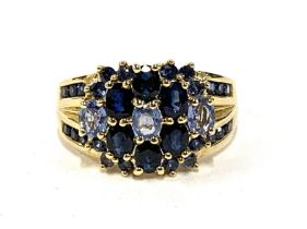 A 9ct gold cluster ring set with sapphires and blue topaz, size P 1/2, 5.3g