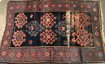 A Caucasian dark blue ground rug, 200x134cm