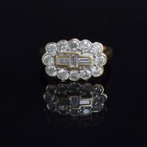 An 18ct gold and diamond cluster ring, the twelve brilliant cut diamonds surrounding a central panel