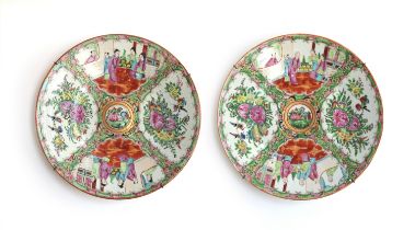 A pair of Chinese export famille rose chargers, 28cm diameter