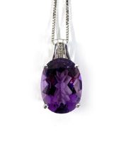 A 14ct white gold mounted amethyst pendant, with a diamond set bail, the amethyst measuring 1.5x1.