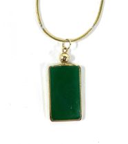 A 14ct gold mounted green onyx rectangular pendant on a 14ct gold chain, the pendant 2.3cmL, the