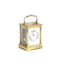 A 19th century French brass repeater carriage clock, the white enamel dial with Roman numerals, 12cm