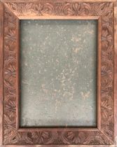 An Arts and Crafts carved oak picture frame, overall 78x62, internal dimensions (including rebate)