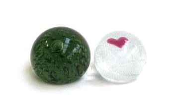 A Whitefriars style green glass paperweight together with a Caithness 'Sweetheart' glass