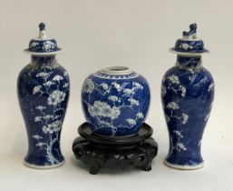 A Chinese blue and white ginger jar on stand, 12cmH; together with a pair of baluster vases and