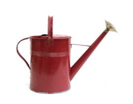 A red painted watering can